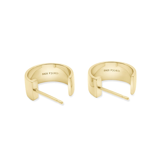 Gold open ended hoop earrings on a white background