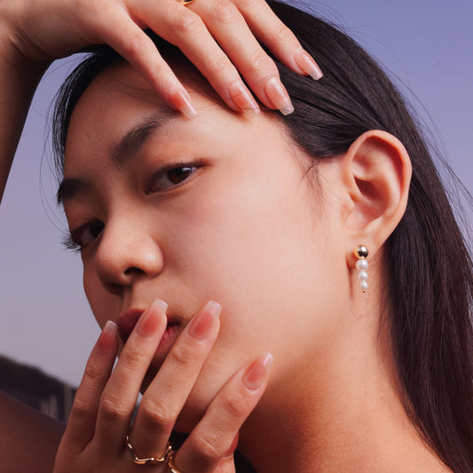 Trio Pearl Drop Earrings worn by model