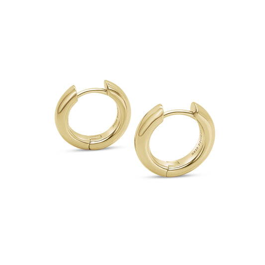 Gold hoop earrings on a white background