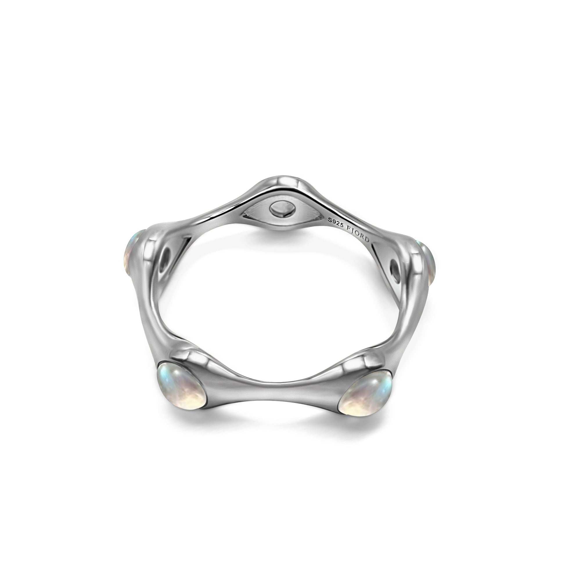 Silver ring with moon stones on a white background