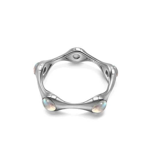 Silver ring with moon stones on a white background