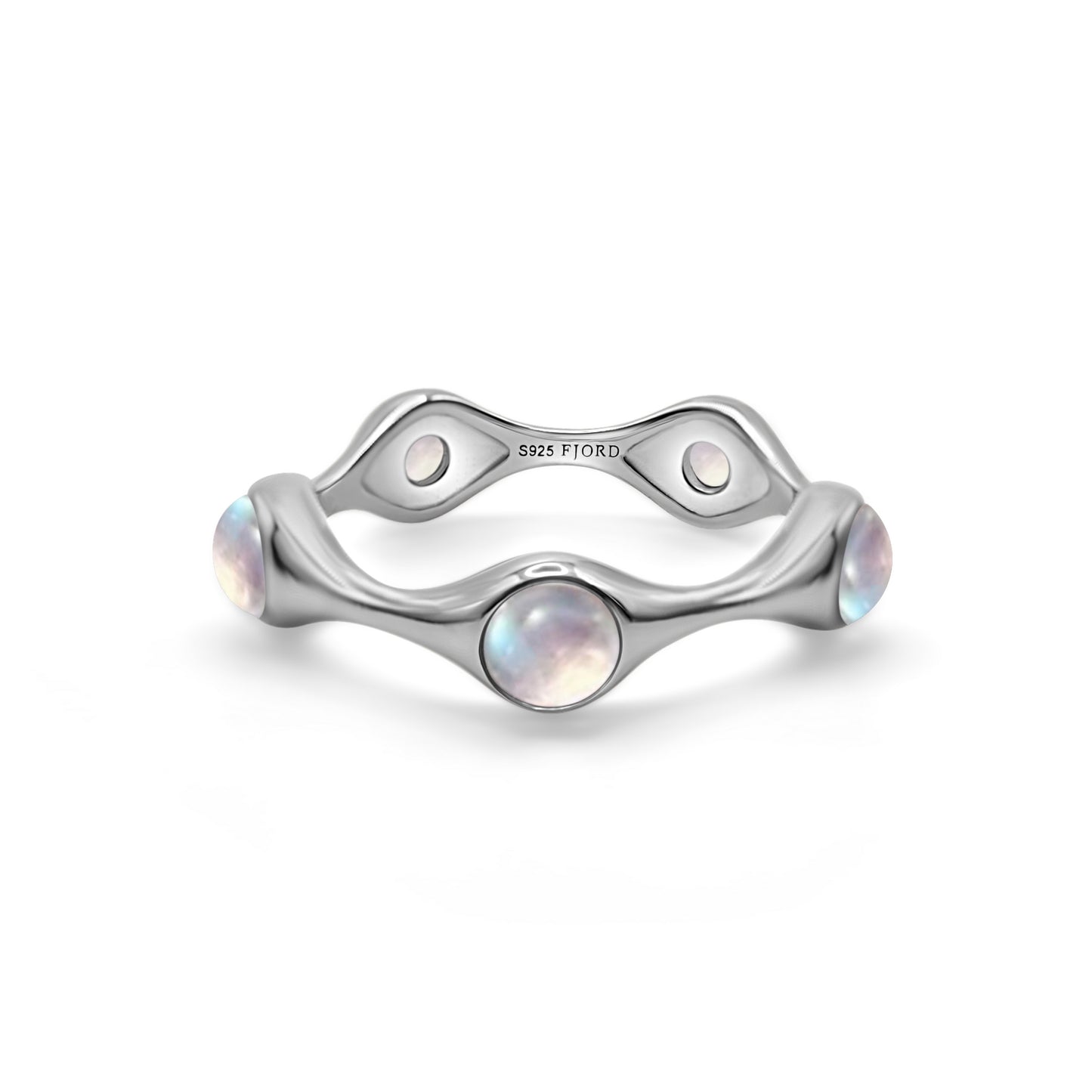 Silver ring with moon stones on a white background