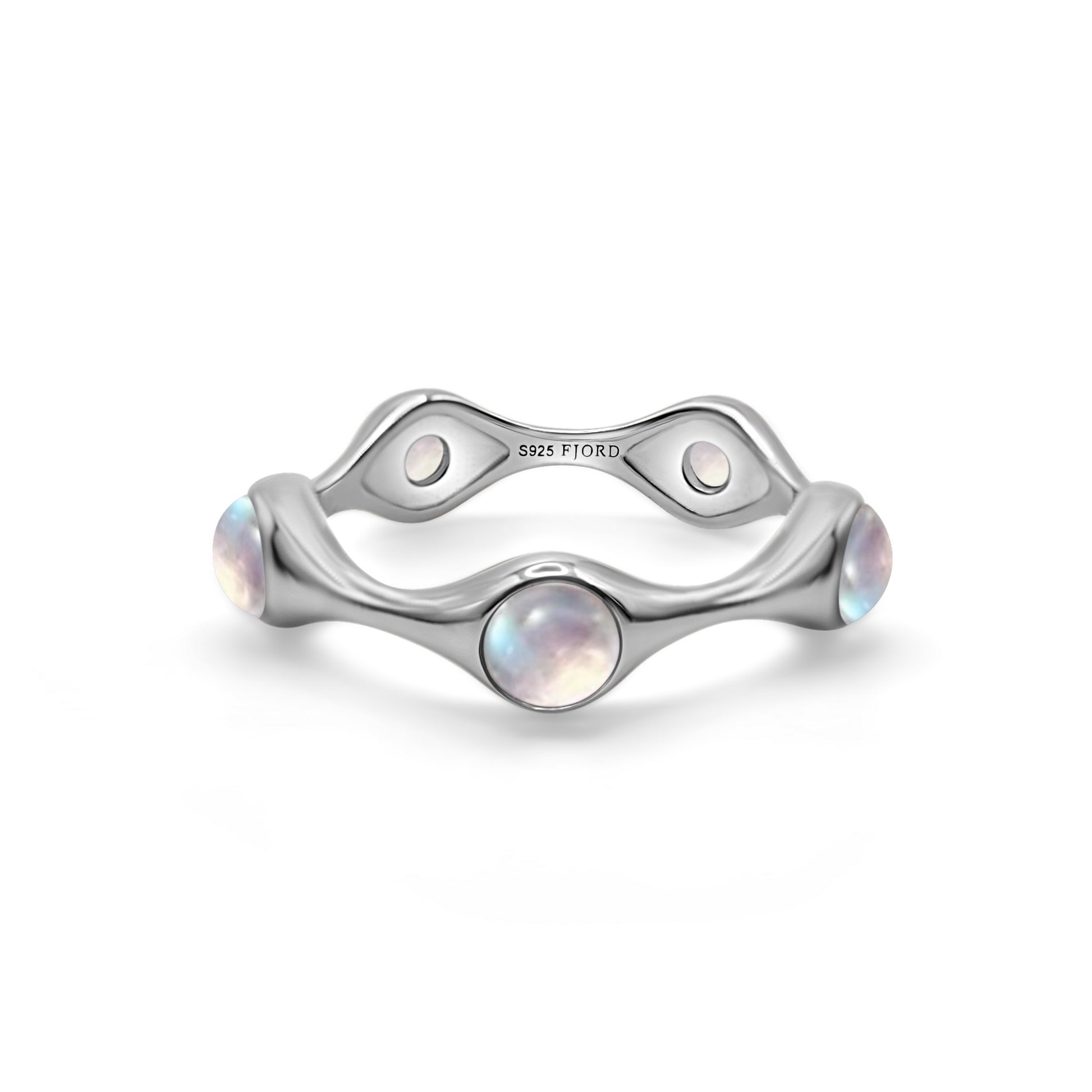 Silver ring with moon stones on a white background