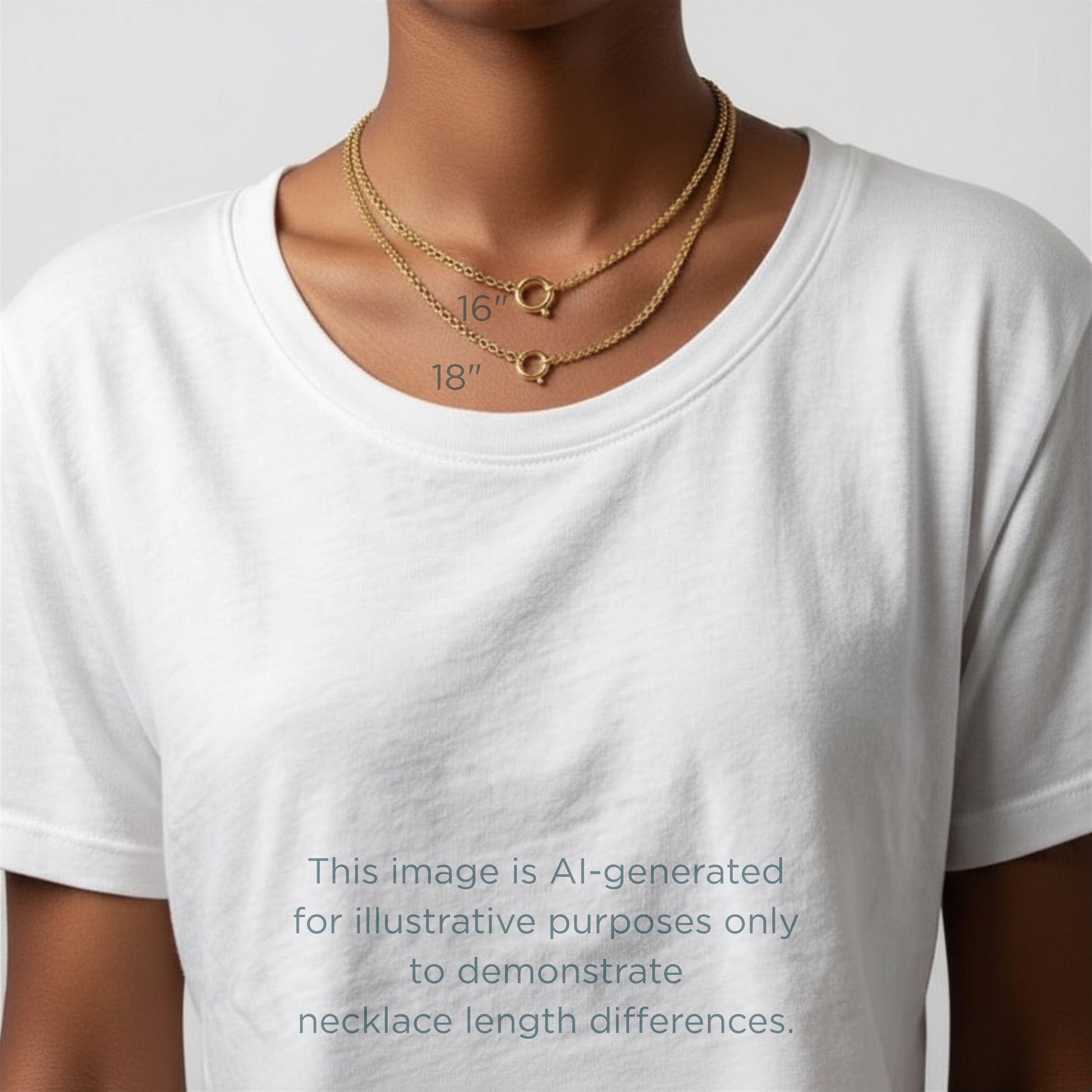 Gold necklaces on a white t-shirt with measurements, on a plain background