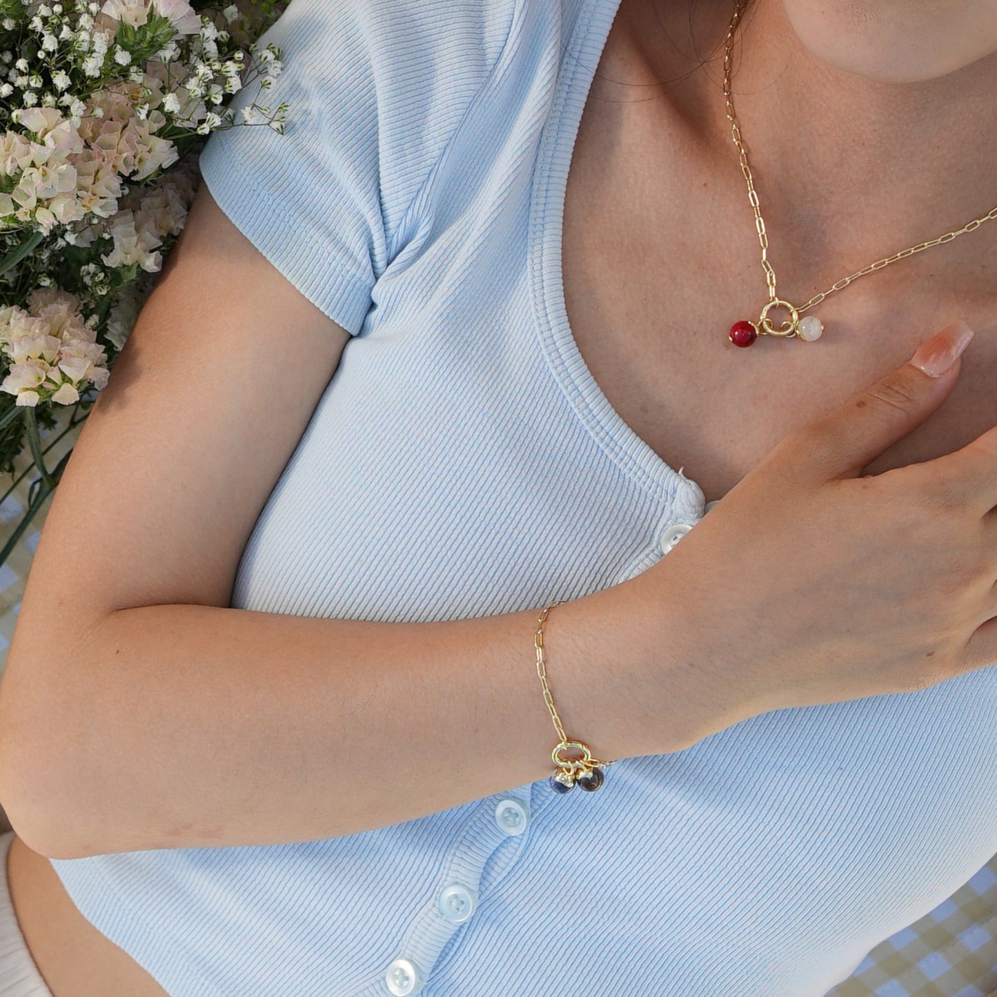 Person wearing Gold Vermeil Paperclip Link Bracelet and necklace with Fjord Energy Charms