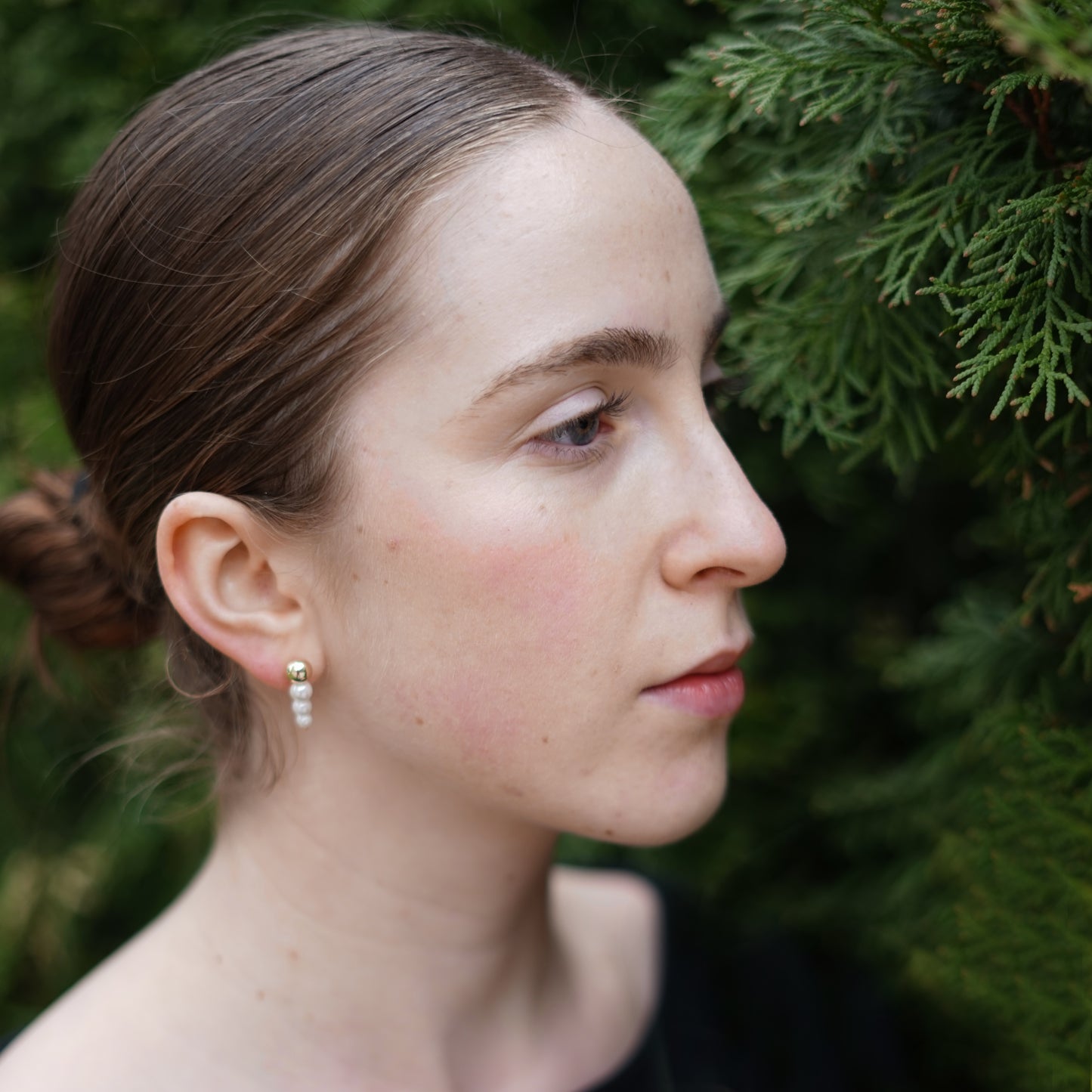 Trio Pearl Drop Earrings worn by model
